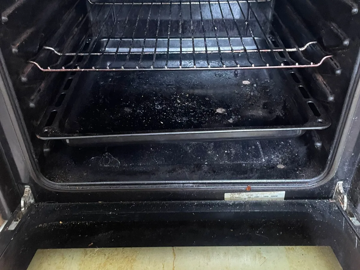 Oven door glass before cleaning